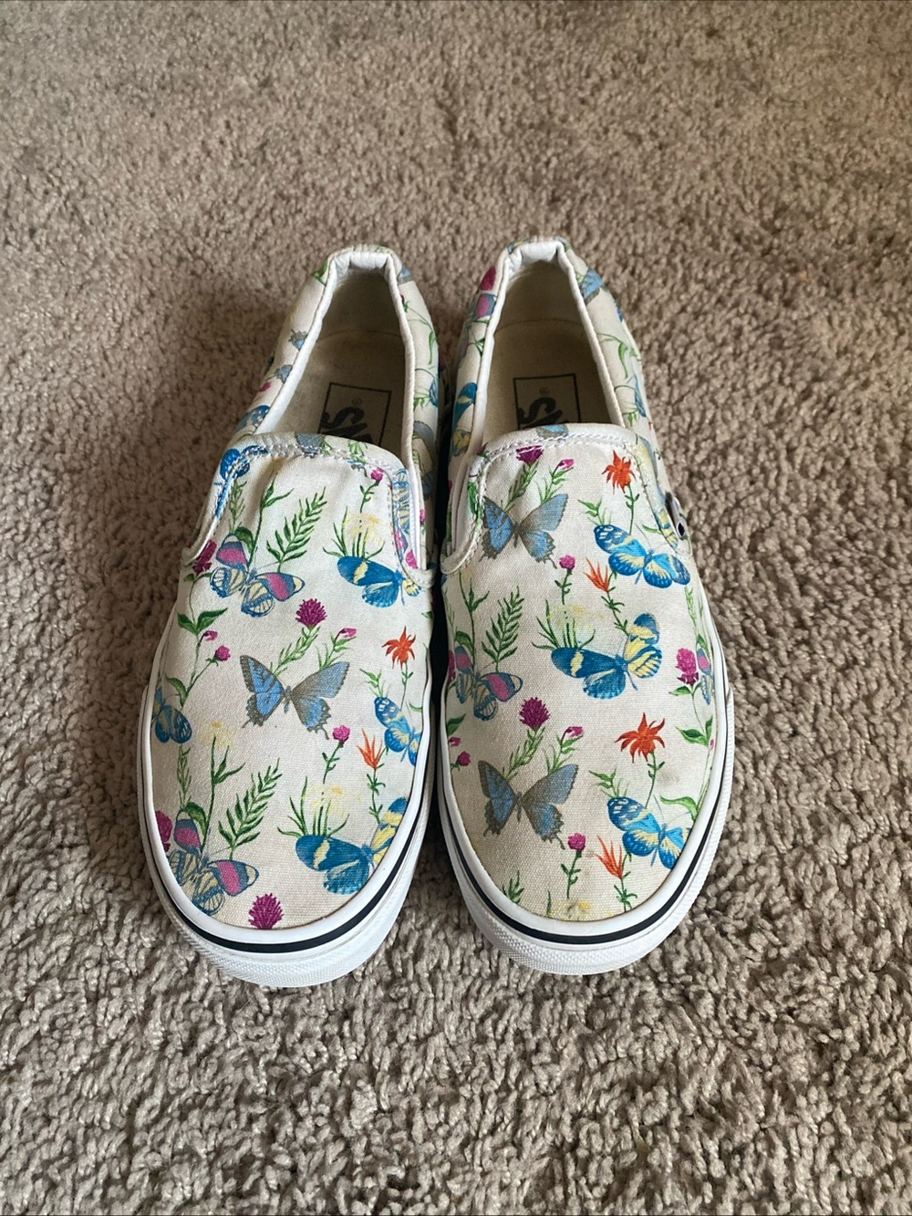 Vans Classic Slip-On Sneakers in White with Blue and Pink Butterfly Floral Print